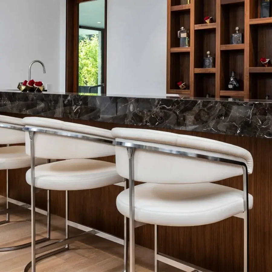Superior Visionnaire Clem stool built with smooth white textile upholstery and a polished brass pipe frame