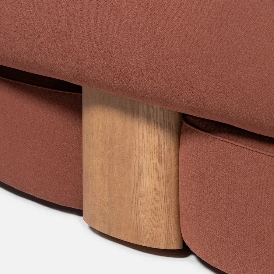 Superior Carpanese Home Slow sofa with textured terracotta textile upholstery and satin finished ash wood supports