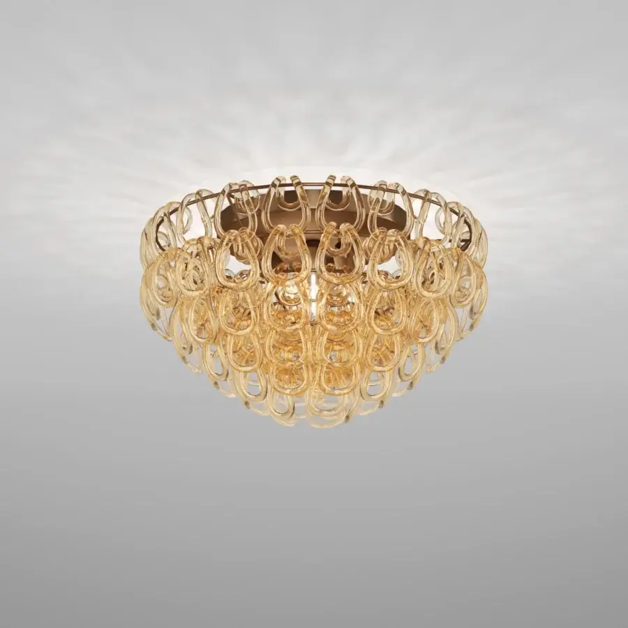 Superior Vistosi Giogali ceiling lamp crafted in interlocking hand-blown glass with a warm amber glossy finish and bronze mounting plate