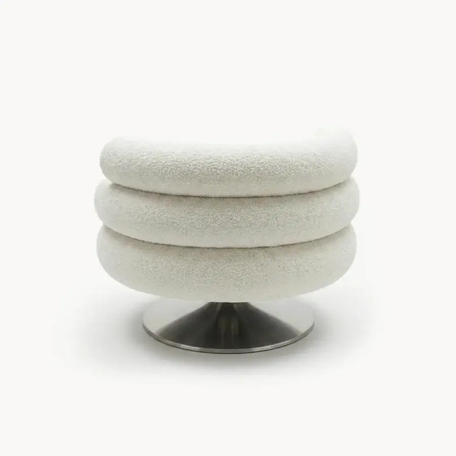 Lavish Visionnaire Voluptas lounge chair crafted in textured off-white bouclé with a polished metal circular base