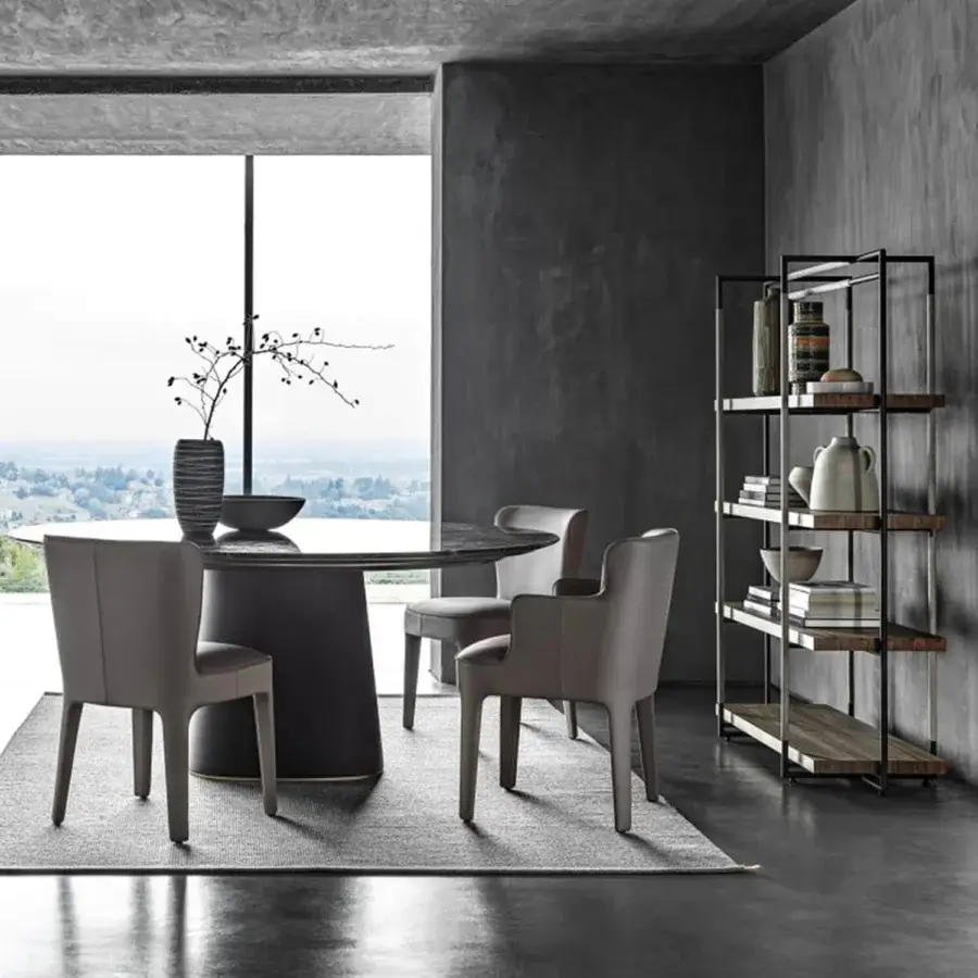Elegant Frag Artù dining table in dark marble with a smooth polished surface and leather-upholstered central base enhanced by metal details