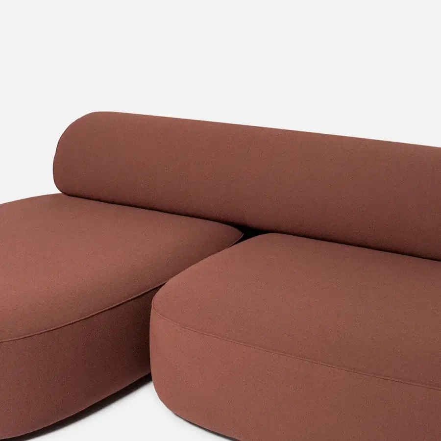 Distinguished Carpanese Home Slow sectional with terracotta textile upholstery and curved organic form built with plywood structure