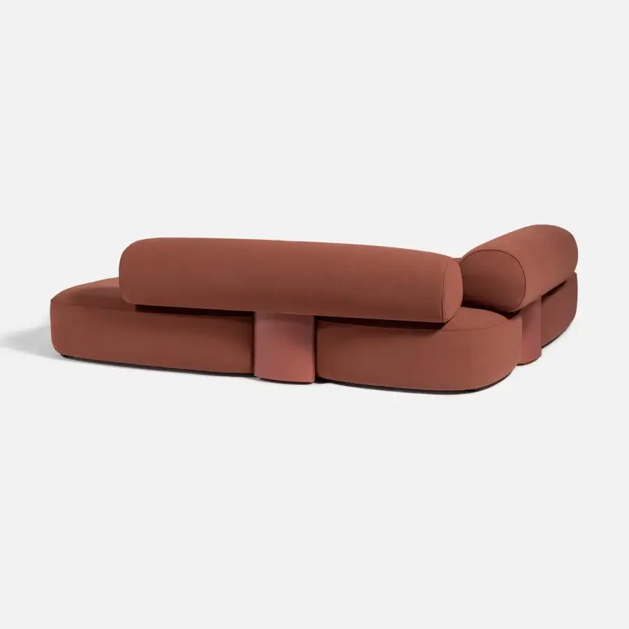 Superior Carpanese Home Slow sectional with terracotta textile upholstery, exposed ash wood supports and sculpted form