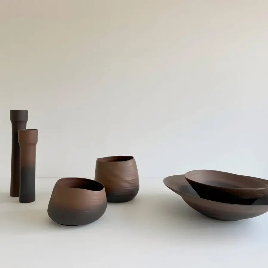 Exceptional Rina Menardi Campanelle centerpiece crafted in baked clay with organic form and dark brown hue