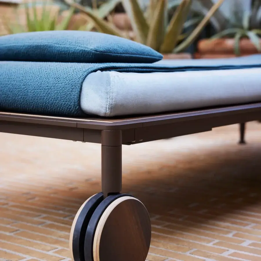 Distinguished Giorgetti Gea lounger with carob powder-coated aluminum and textured muted blue breathable cushioning