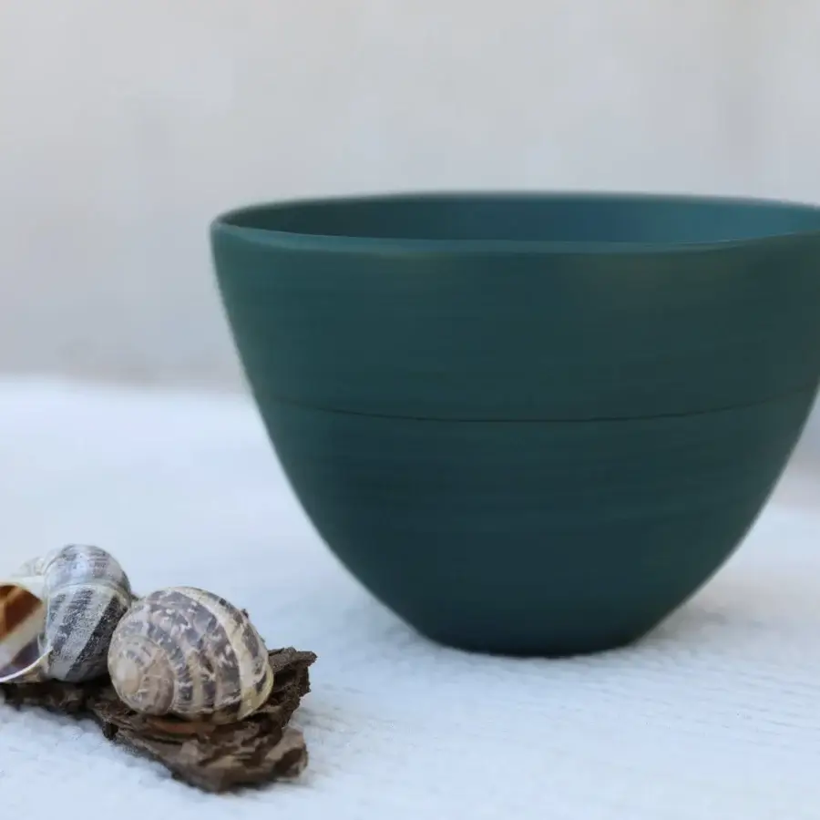 Elegant Rina Menardi Ciotole bowl crafted from baked clay in a captivating muted teal green with a smooth matte finish