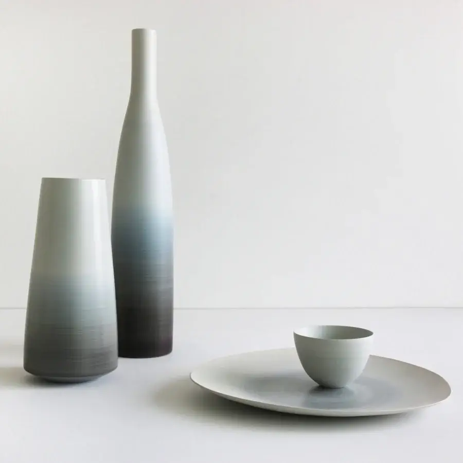 Exceptional Rina Menardi Ciotole bowls crafted in baked clay with grayscale gradients and smooth matte texture