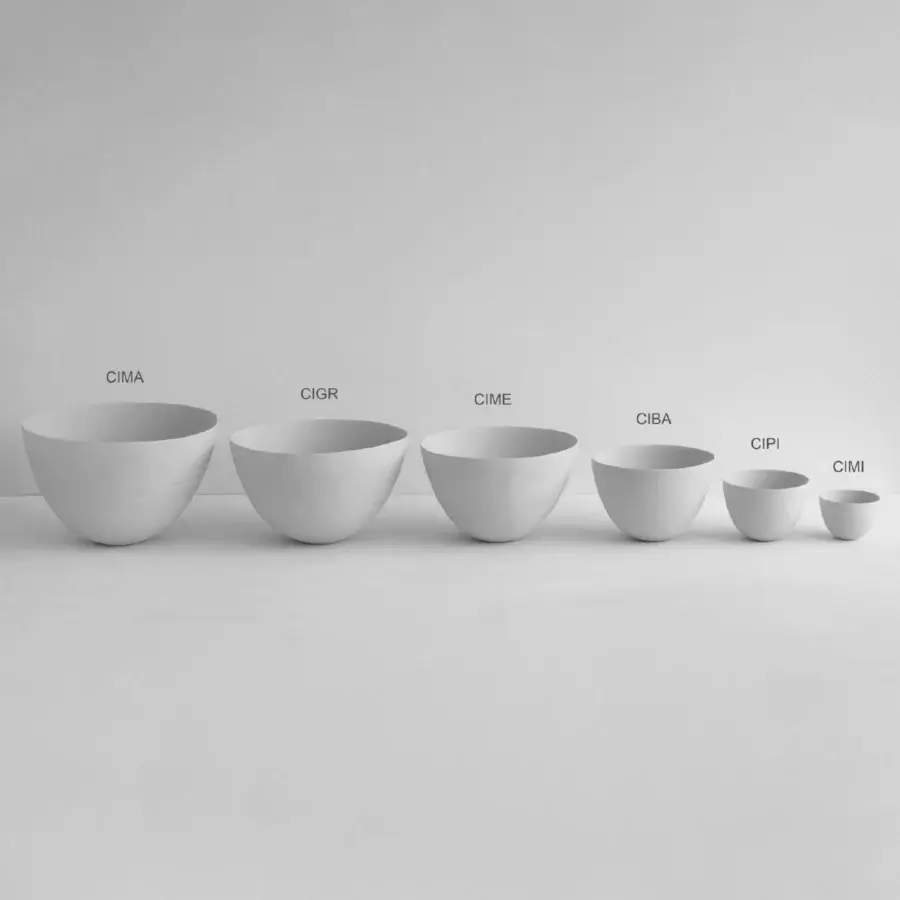 Distinguished Rina Menardi Ciotole bowls crafted from baked clay with a smooth matte finish in a neutral gray-white tone
