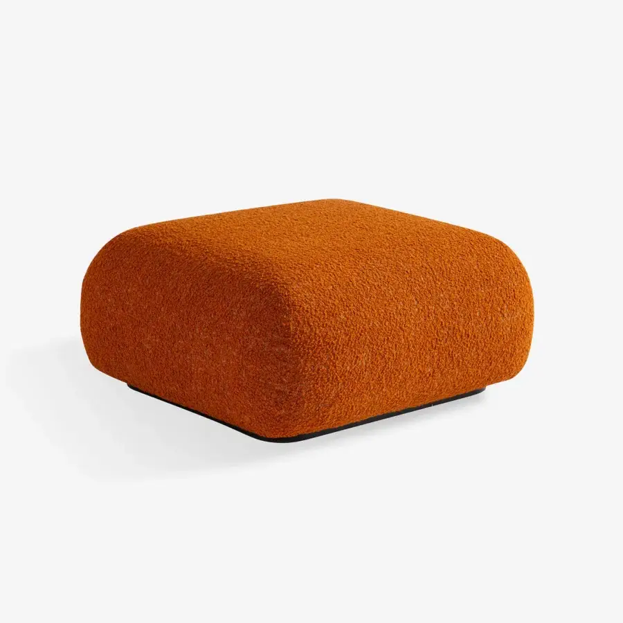 Lavish Carpanese Home Bubble Lounge chair upholstered in warm orange bouclé fabric with a dark perimeter base crafted in Italy