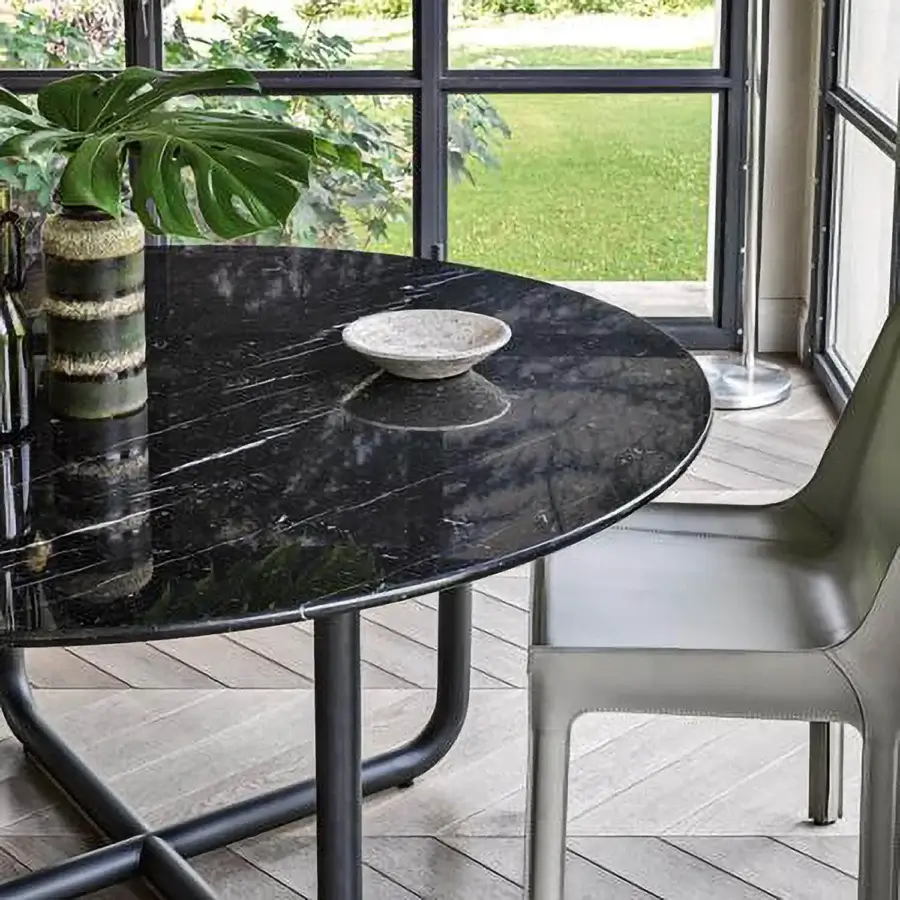 Elegant Dainelli Studio Frag Paipu dining table with polished marble and curved matte black steel tubes inspired by 1970s design