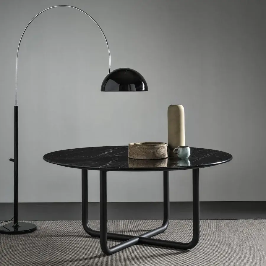 Elegant Dainelli Studio Frag Paipu dining table with a glossy polished marble top and matte black steel base