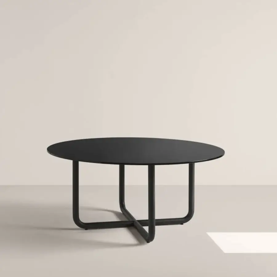 Elegant Frag Paipu dining table crafted with dark gray matte finish, curved steel tubes and a luxurious marble top for structural clarity