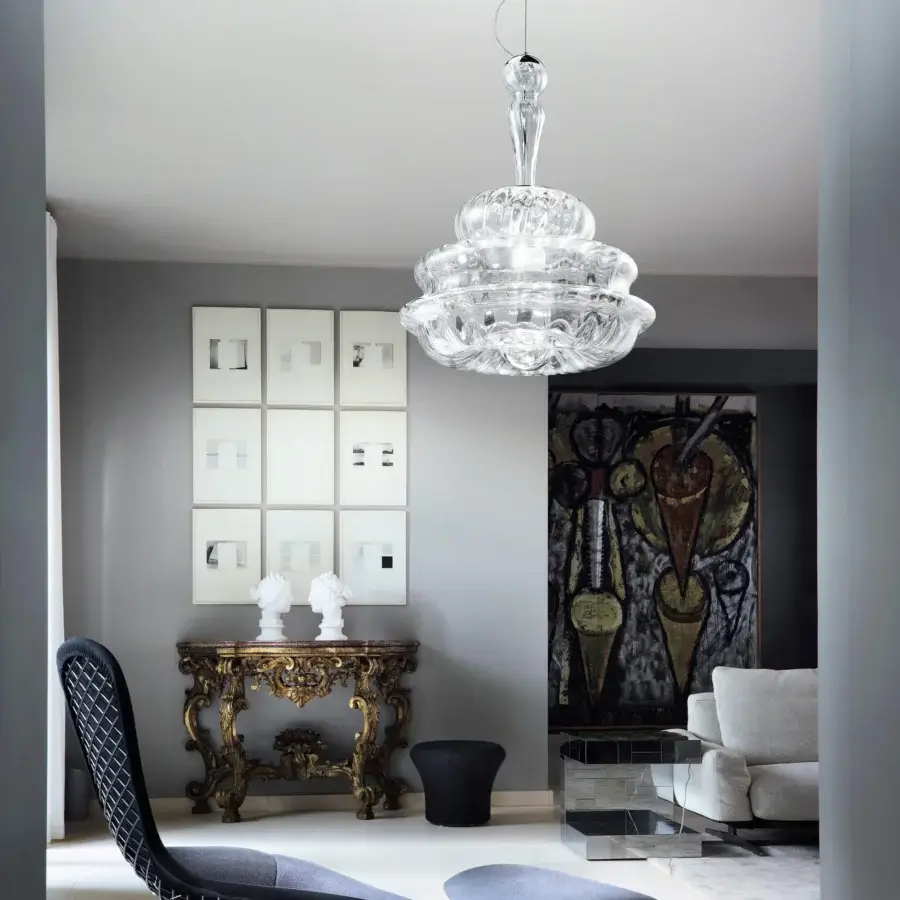Distinguished Vistosi Novecento suspension lamp crafted in clear glass with a signature rigadin finish and rounded form