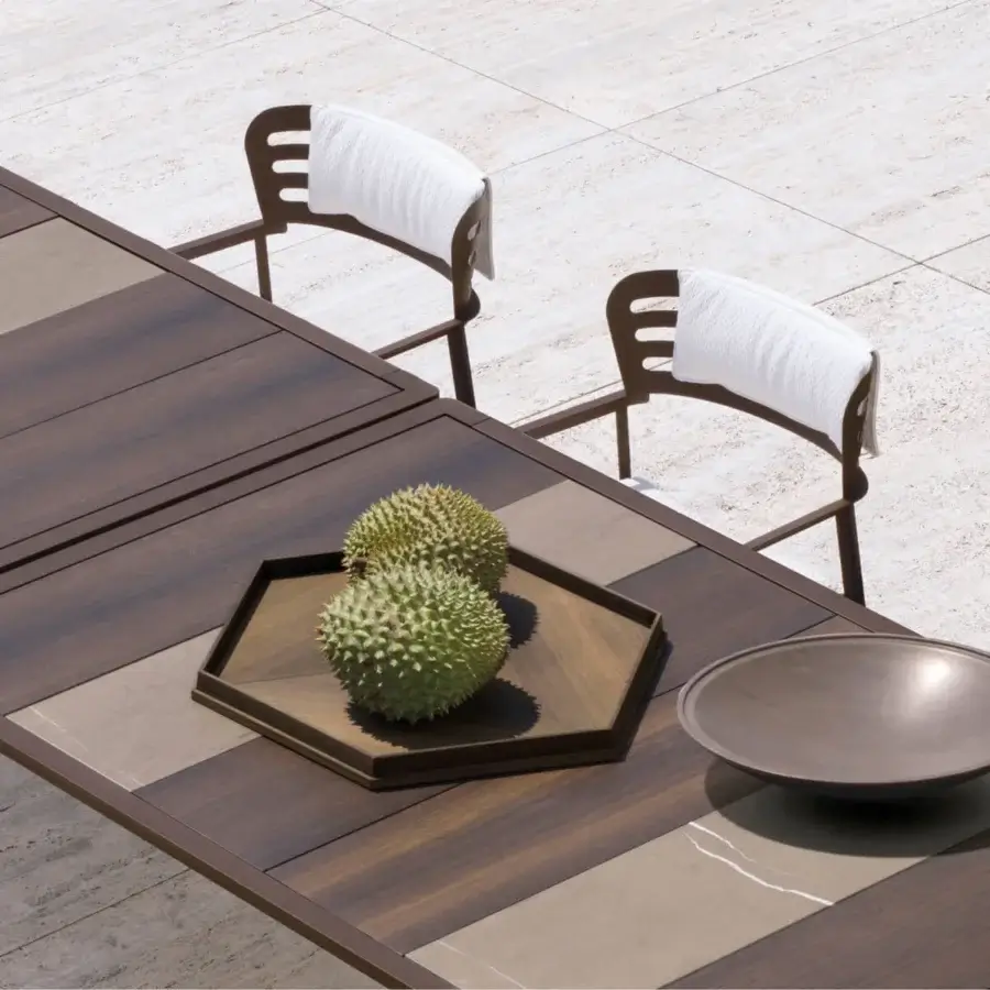 Exceptional Giorgetti Gea table built with stone oak, Afrormosia wood, and carob powder-coated aluminum in a satin finish