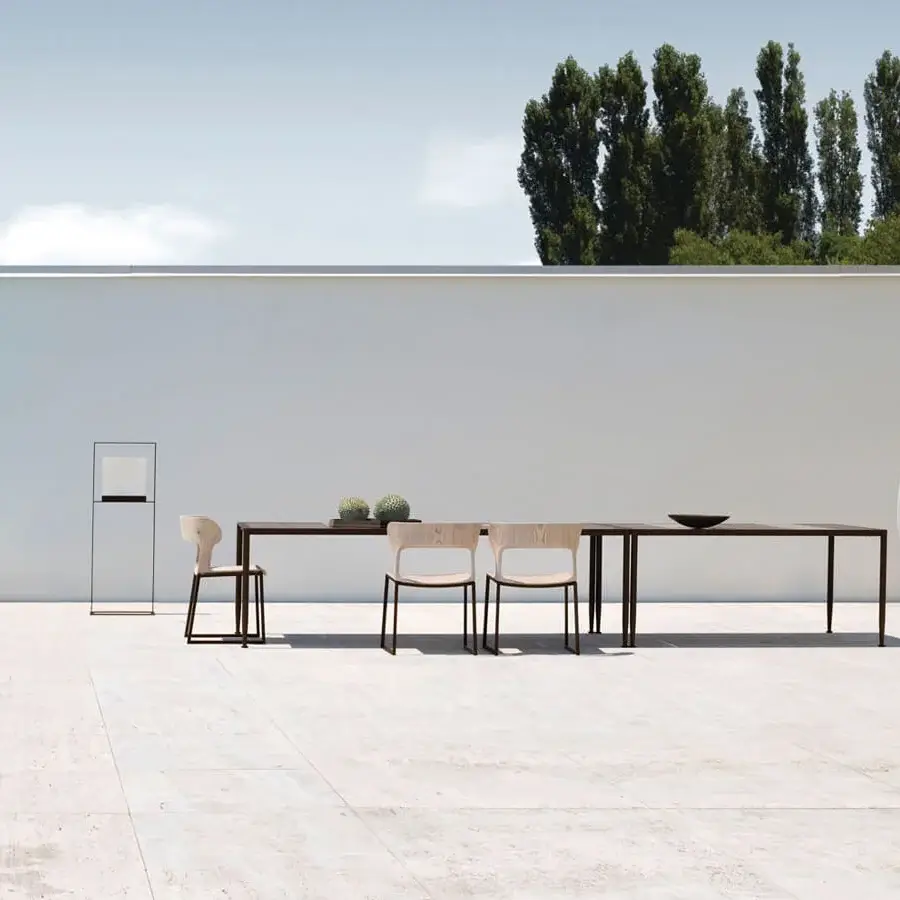 Distinguished Giorgetti Gea table crafted with carob aluminum and stone oak exhibiting a smooth finish