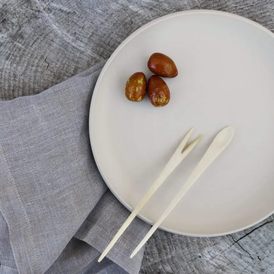 Exceptional Rina Menardi Cerchi plates crafted in baked clay with a smooth matte finish and pale cream tone