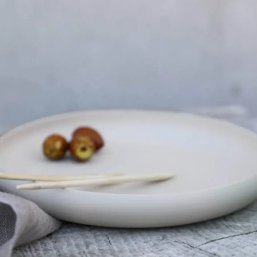 Luxury Rina Menardi Cerchi plates crafted from baked clay with a smooth matte finish and subtle variations
