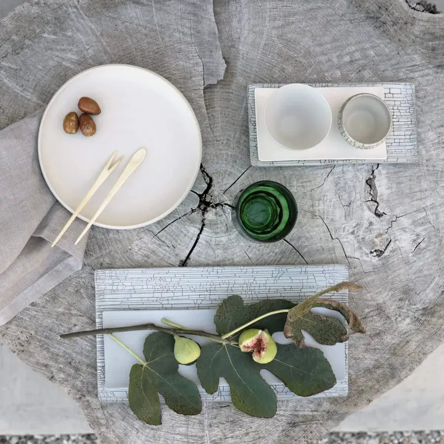 Exclusive Rina Menardi Cerchi plates crafted in baked clay with a smooth matte white finish for unique display