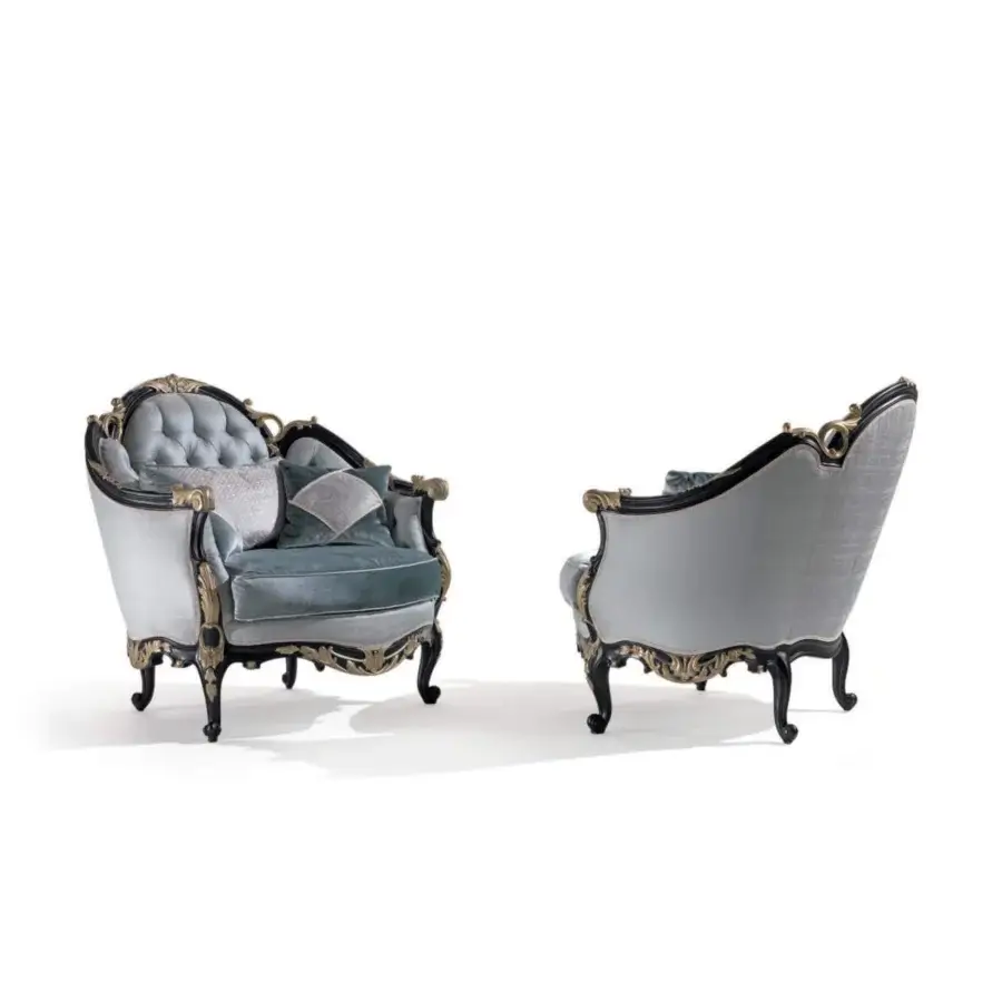 Distinguished Armando Rho A1384 lounge chair with light blue quilted upholstery and black distressed wood frame with antique silver leaf