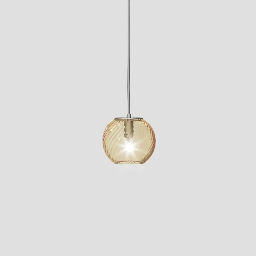 Distinguished Vistosi Oto suspension lamp crafted in blown glass with warm amber coloring and polished silver-toned metal cable