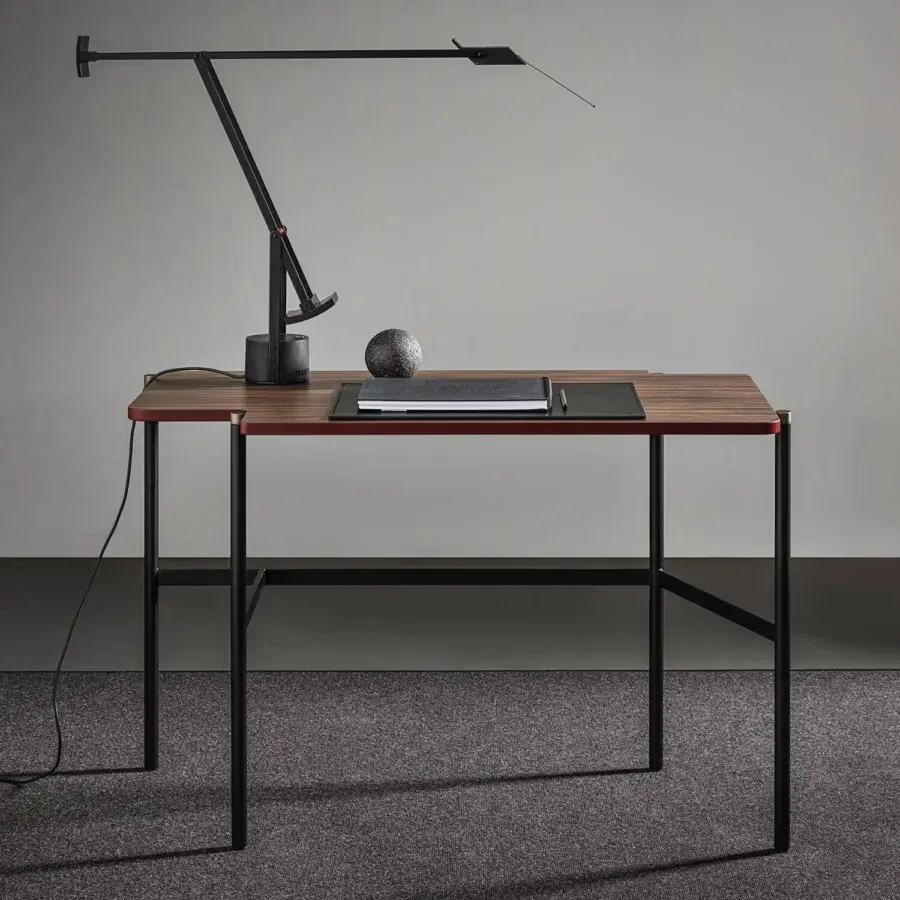Distinctive Frag Arita desk table crafted in medium-dark satin-finish wood with a black metal leg structure and burnished brass caps