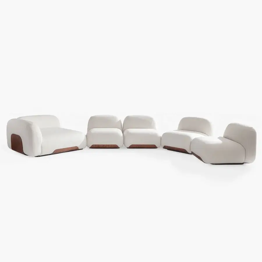 Elegant Carpanese Home Bubble Sectional sofa with creamy white textile upholstery and warm brown curved wood base