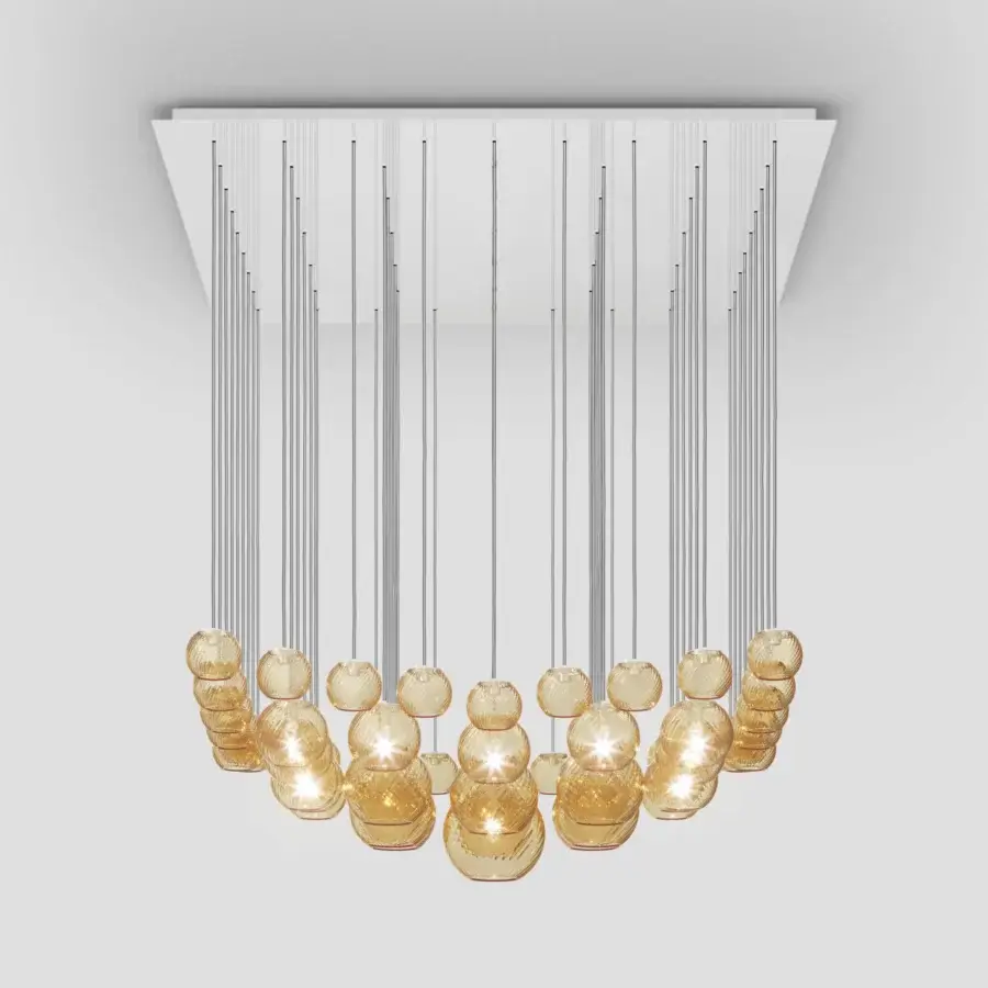 Distinguished Vistosi Oto suspension lamp crafted in warm amber Murano glass with a polished metal finish and rigadin texture
