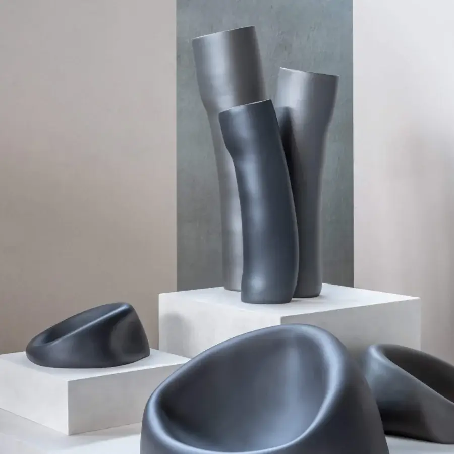 Distinguished Rina Menardi Clio centerpiece crafted in baked clay with a minimalist matte finish and organic curved form