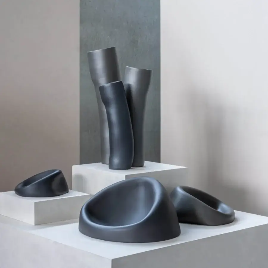 Exceptional Rina Menardi Clio centerpiece sculpted from baked clay with a smooth matte finish in dark gray hues