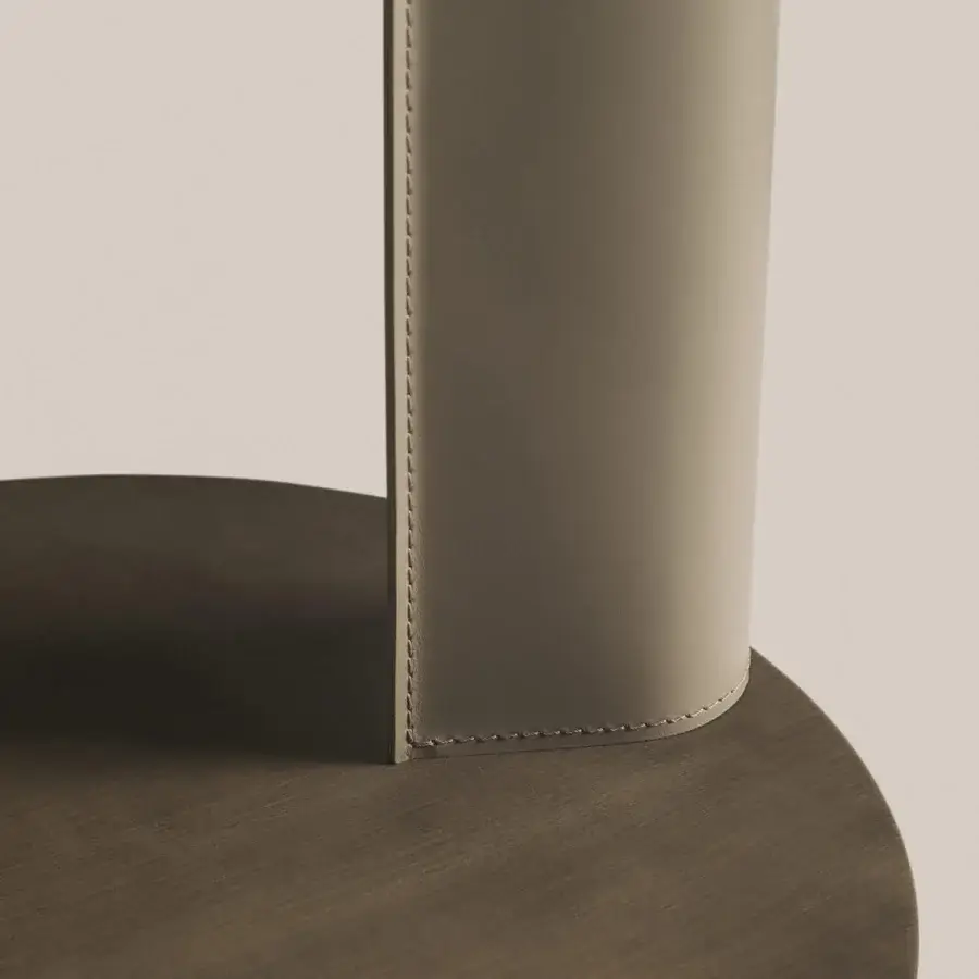 Elegant Frag Bler side table crafted with steel and saddle leather, showcasing muted olive green with a brushed finish