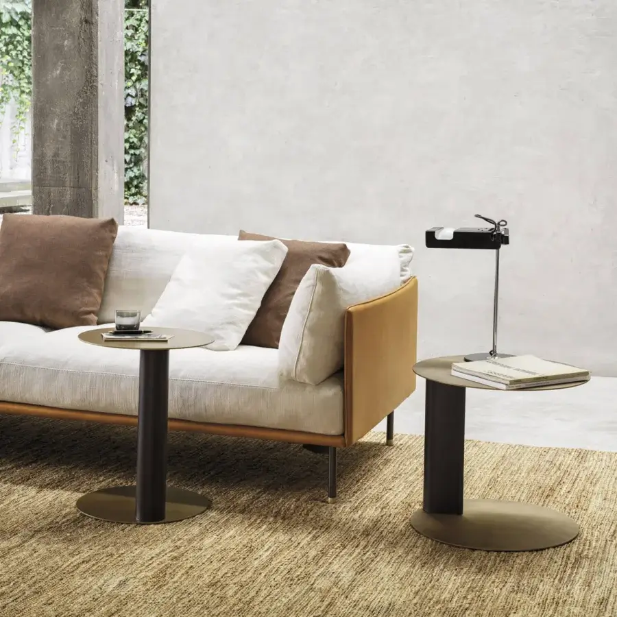Distinguished Frag Bler side table built with steel and saddle leather, displaying a brushed finish