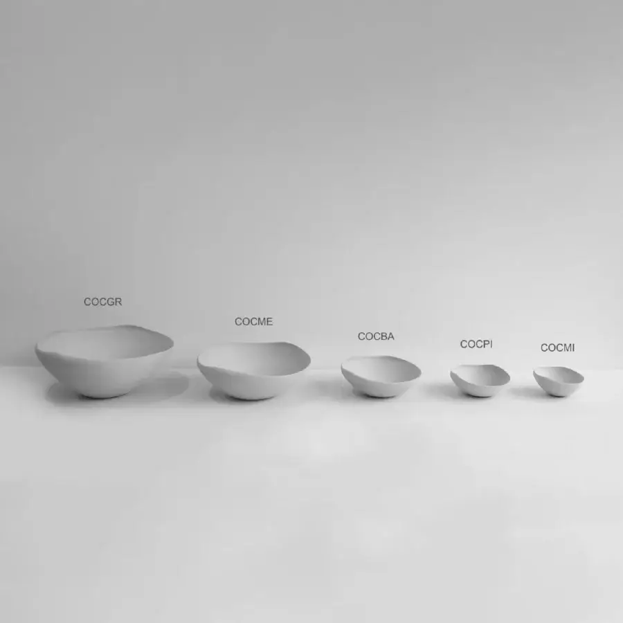 Distinguished Rina Menardi Conchiglie centerpiece crafted in baked clay with a minimalist light gray tone and unique artisanal finish