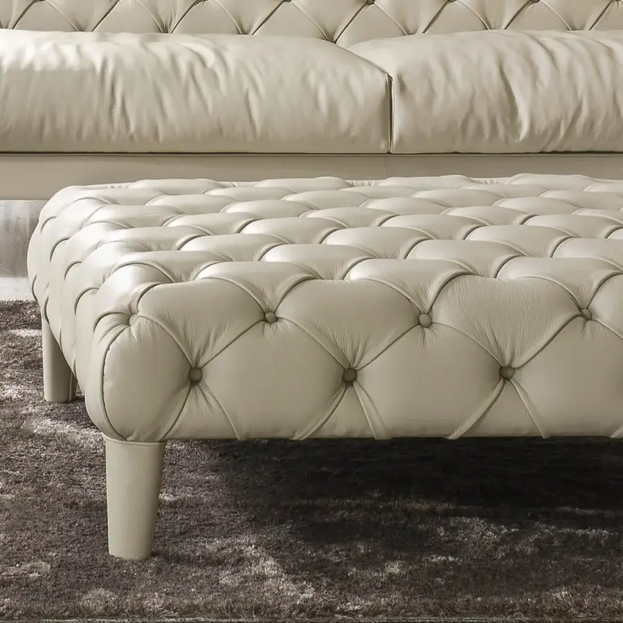 Distinguished CTS Salotti Elliot ottoman crafted in neutral beige with refined capitonné upholstery and cylindrical legs