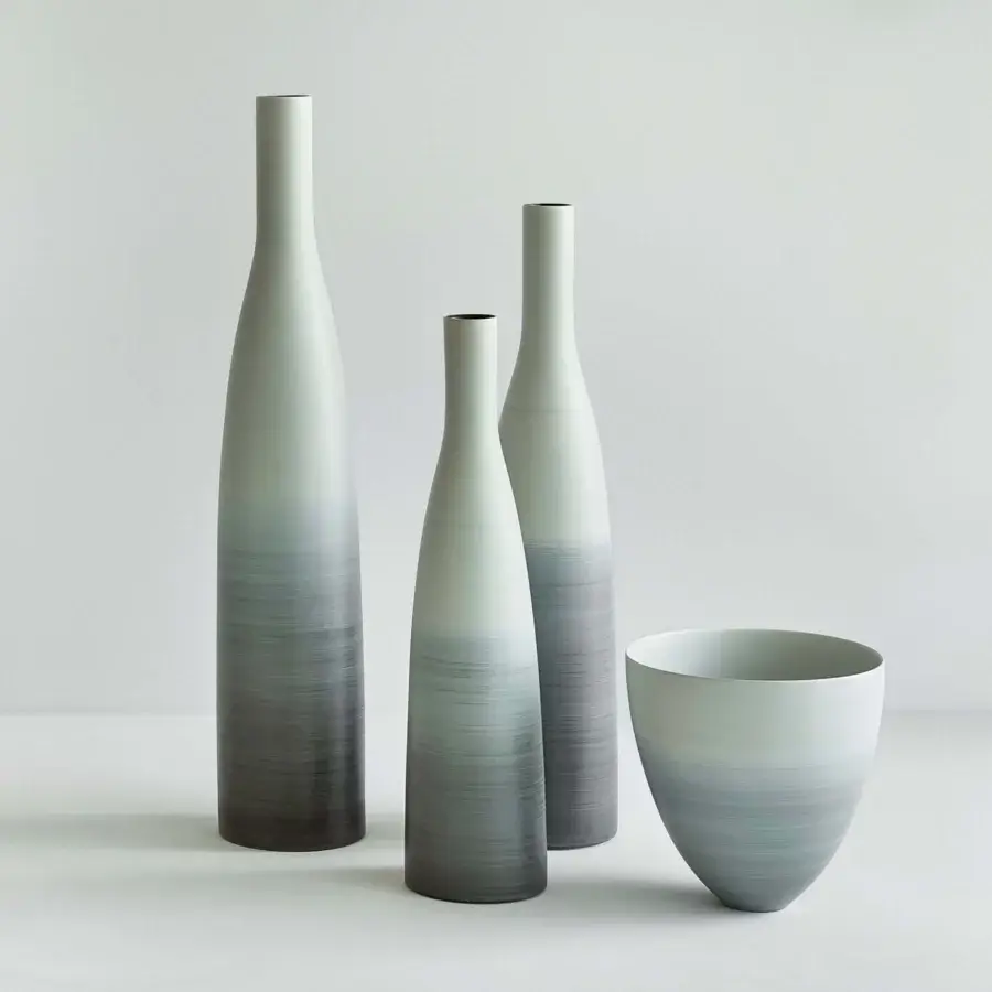 Sophisticated Rina Menardi Coppe vase crafted from baked clay exhibiting a brushed finish with subtle gray to charcoal tones