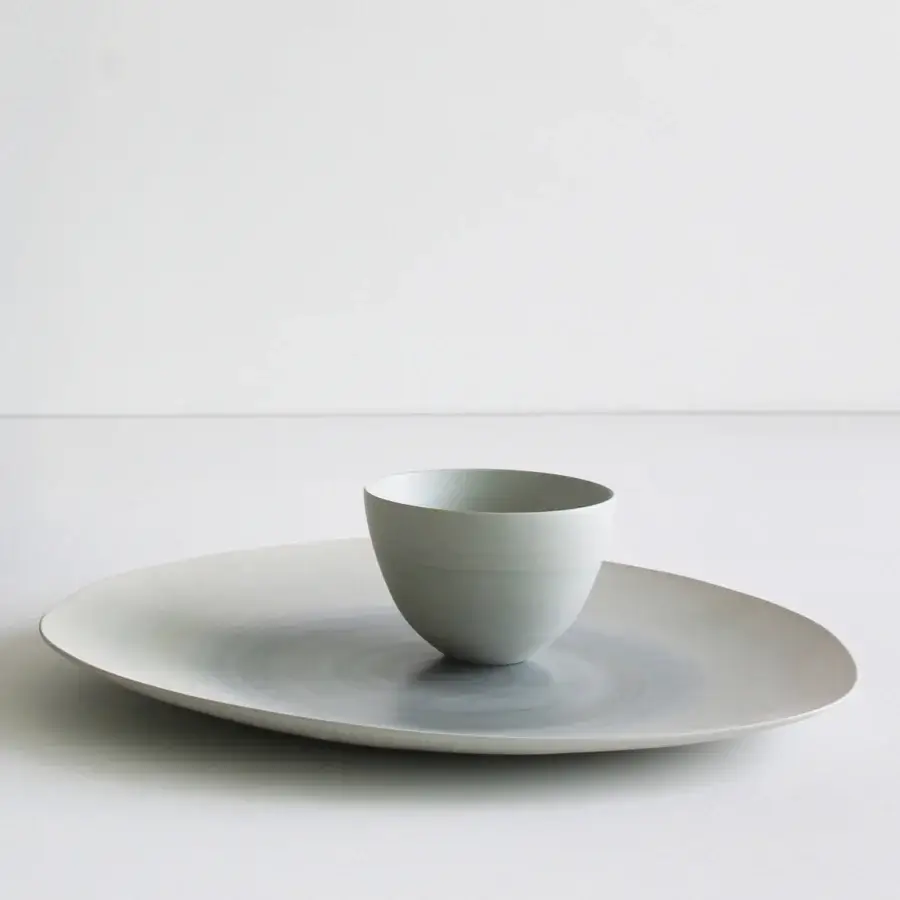 Elegant Rina Menardi Coppe vase crafted in baked clay with a pale gray matte finish and organic forms