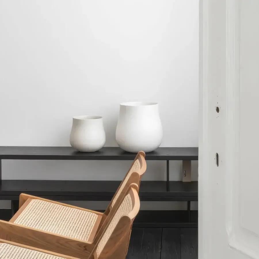 Exceptional Rina Menardi Delos vase crafted in baked clay with a smooth matte white finish embodies contemporary form