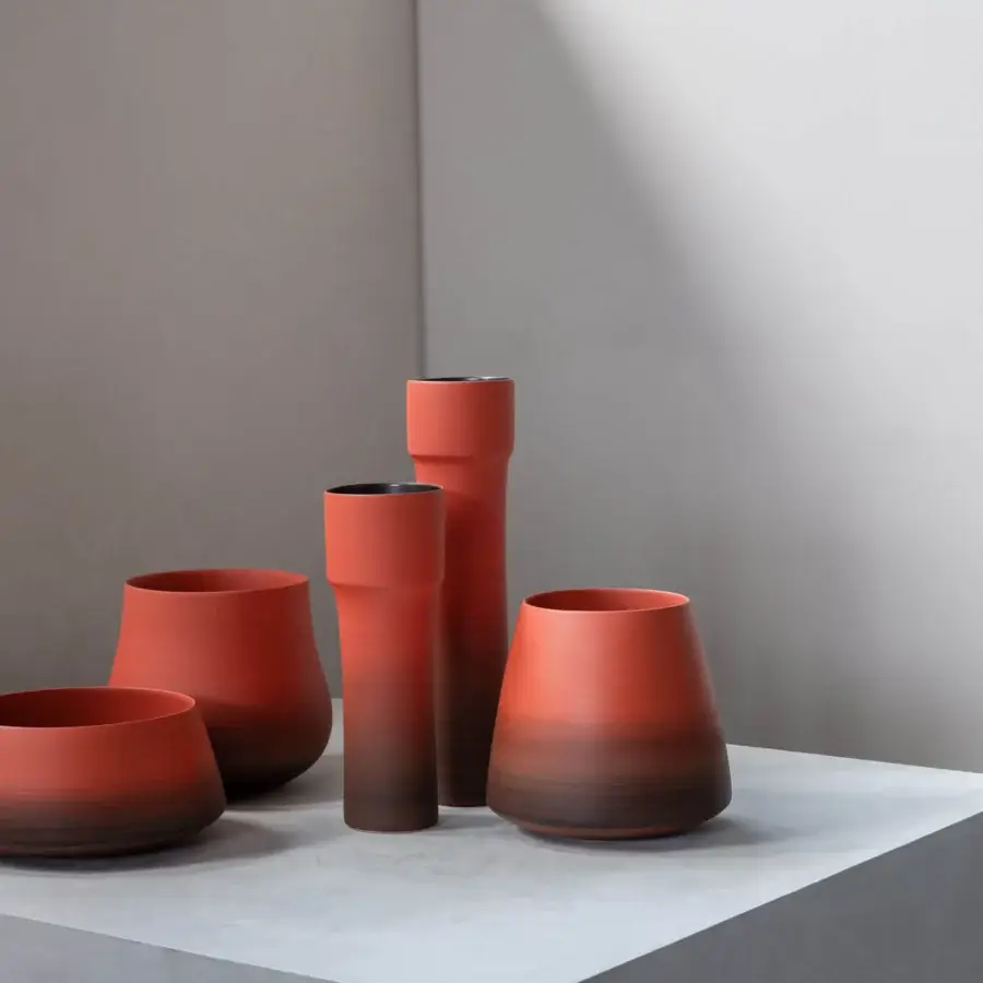 Exclusive Rina Menardi Delos vase crafted from baked clay in Italy with reddish-brown to chocolate-brown gradients and a matte finish