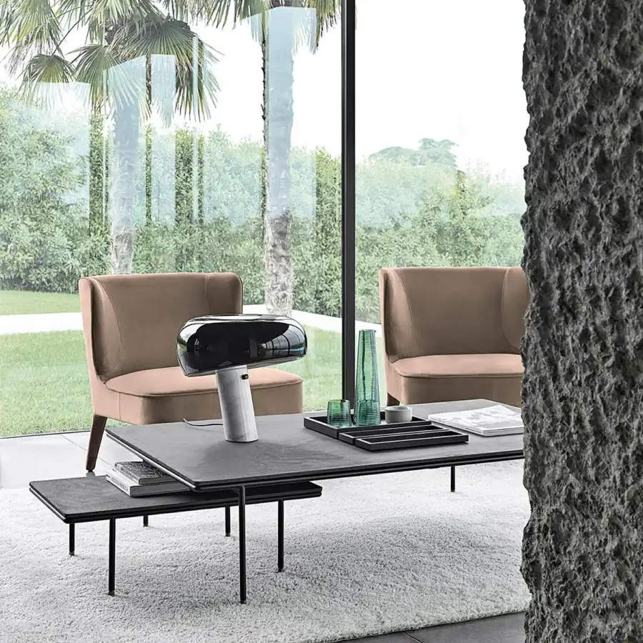 Elegant Frag Square coffee table with dark tabletops and sleek black metal legs in a matte finish