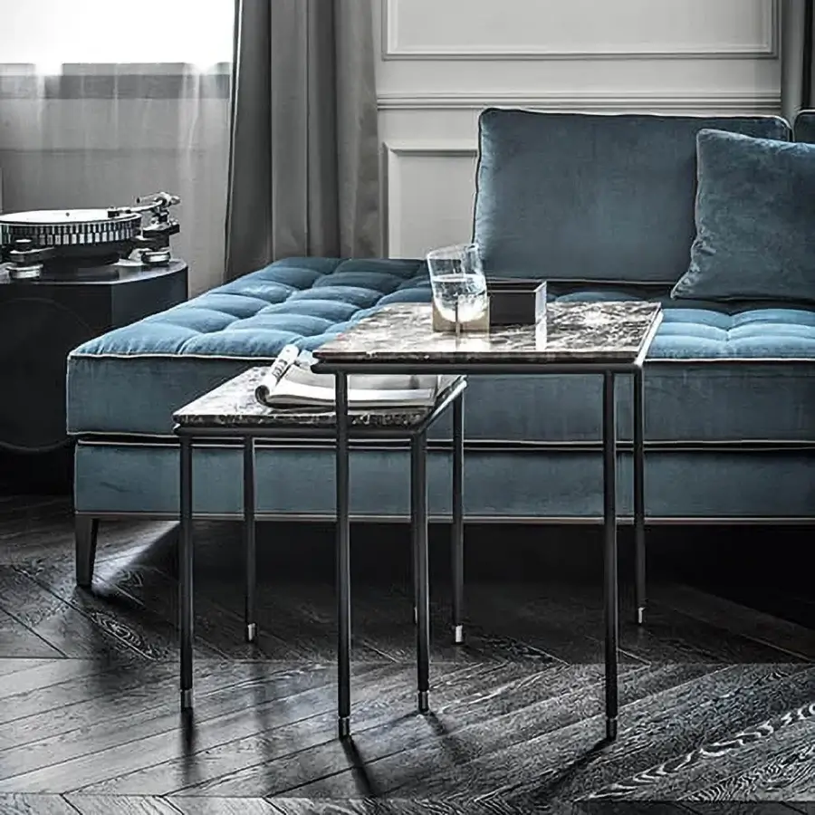 Superior Frag Square coffee table in Italy with a dark gray metal frame and patterned stone tabletop