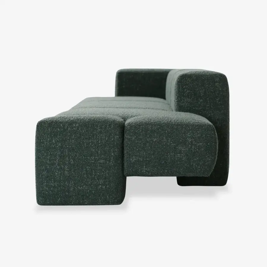 Captivating Carpanese Home Cusco sofa with sculpted form upholstered in textured matte teal fabric and plywood frame