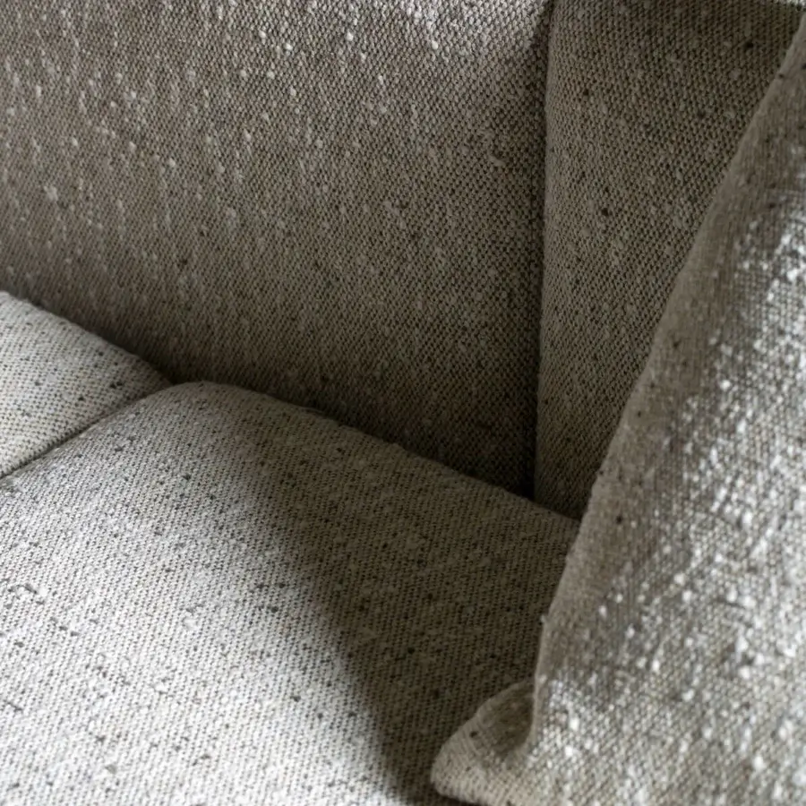 Elegant Carpanese Home Cusco sofa with relaxed geometry upholstered in light gray textured fabric and matte finish