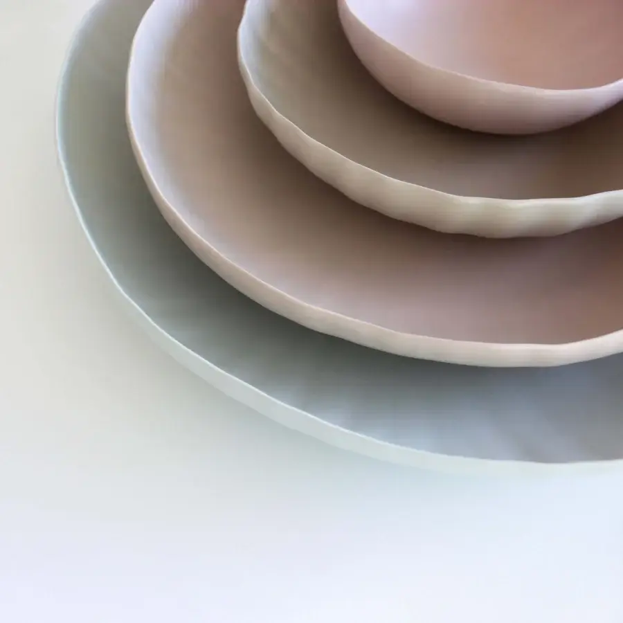Exclusive Rina Menardi Fiori centerpiece crafted in baked clay with soft blush pink finish and layered sculptural form