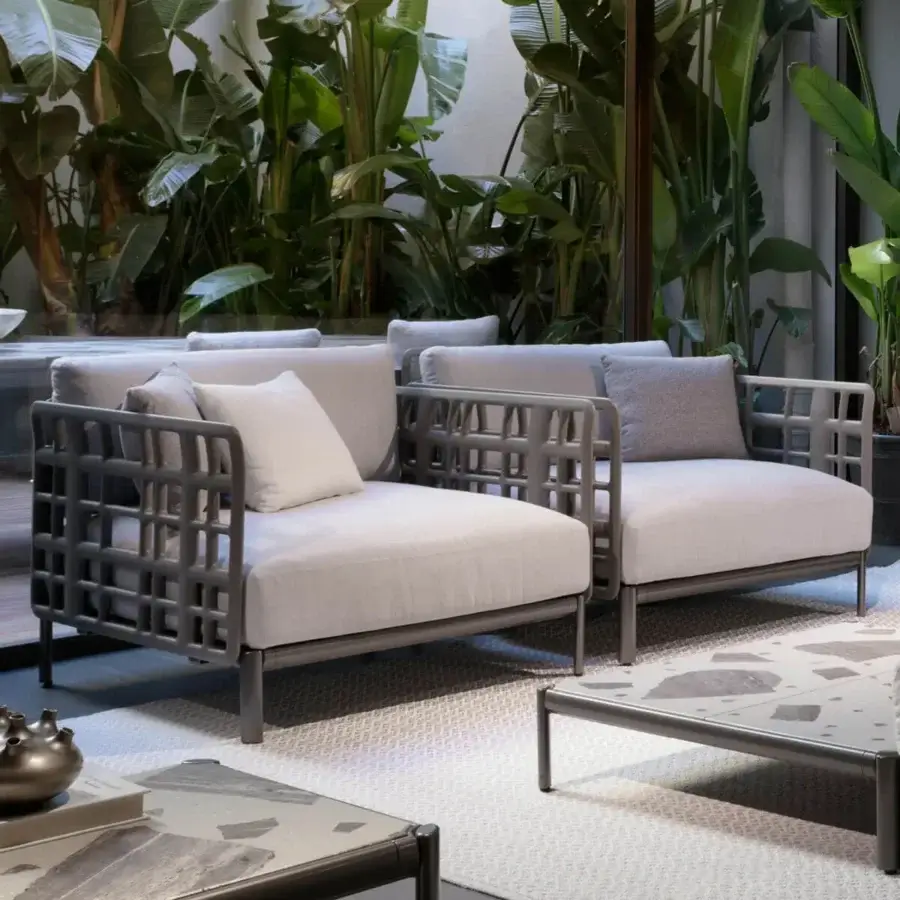 Elegant Giorgetti Aldìa lounge chair with pewter painted metal and natural reconstituted birch plywood backrest, upholstered in light grey-white fabrics
