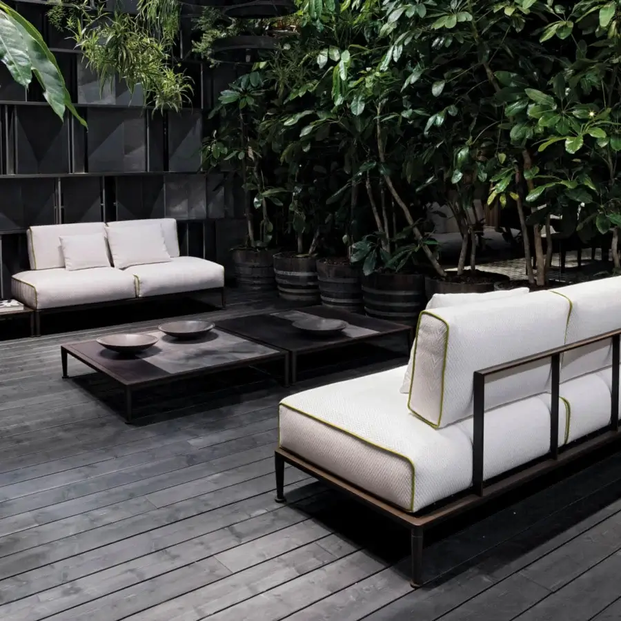Superior Giorgetti Gea sofa with a carob powder-coated aluminum frame and comfortable off-white waterproof cushions featuring lime green piping