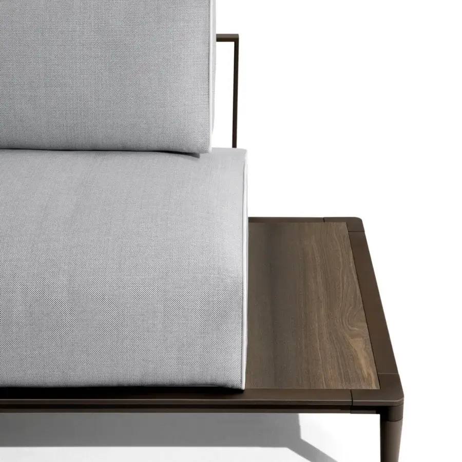 Distinguished Giorgetti Gea sofa with a carob powder-coated aluminum frame, warm wooden extension, and textured neutral gray waterproof upholstery