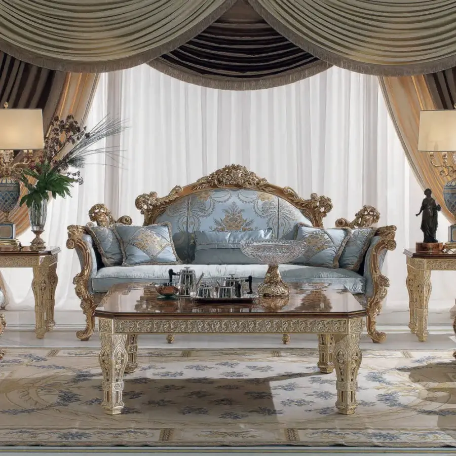 Distinguished Armando Rho A1225 sofa with pale blue textile and sculpted natural oak frame accented with refined gold leaf detailing