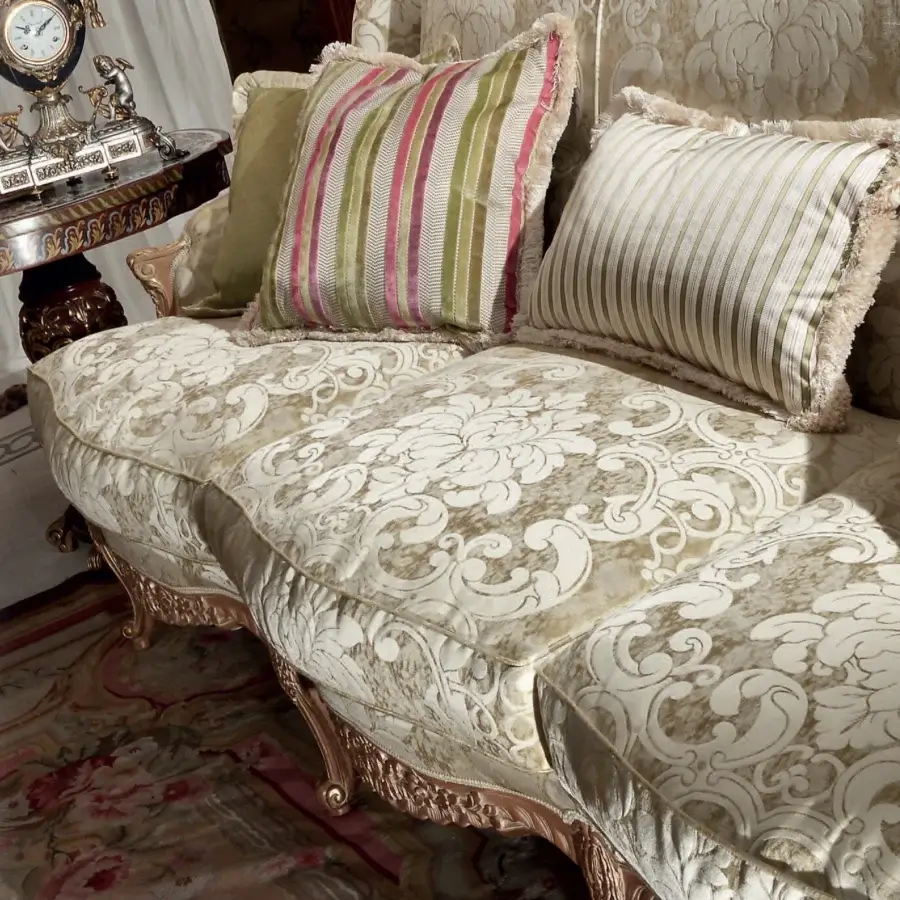 Lavish Armando Rho A1177 sofa upholstered in luminous off-white and gold patterned textile with natural oak and gold leaf accents