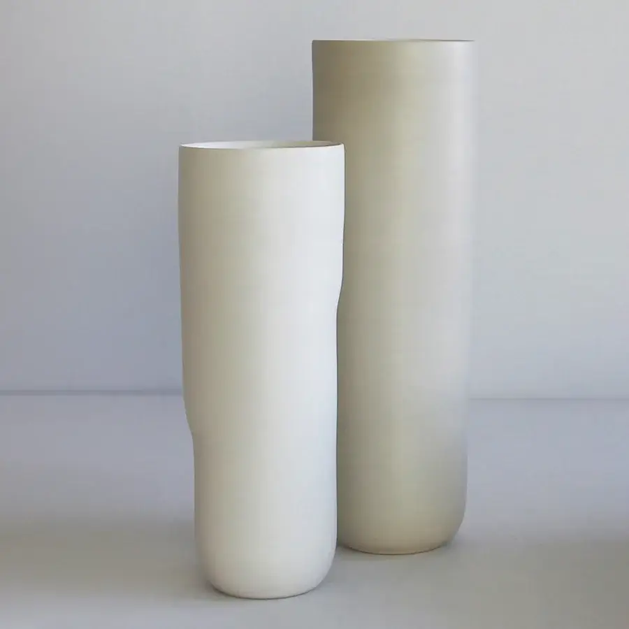 Distinguished Rina Menardi Menhir vase crafted in pale ceramic with a smooth matte finish and subtly undulating silhouette