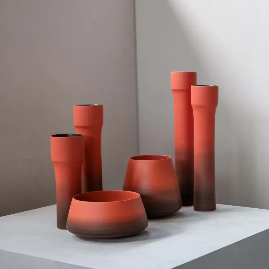Distinguished Rina Menardi Mono Vases, cylindrical ceramic vessels crafted in Italy with a gradient terracotta to chocolate brown finish