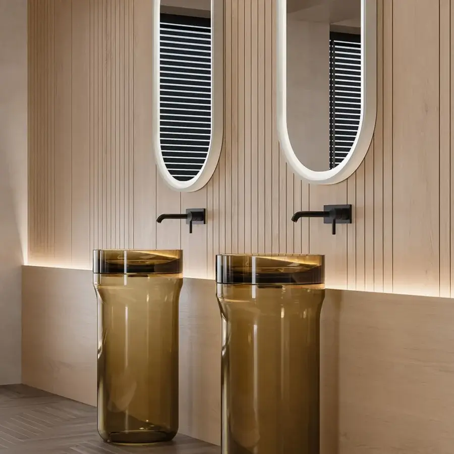 Innovative NORAH DESIGN ISCN 01 sink crafted in warm amber Norahcrystal with a frosted base and polished rim